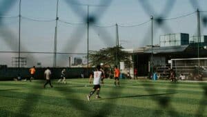 Multiple people playing football on the field