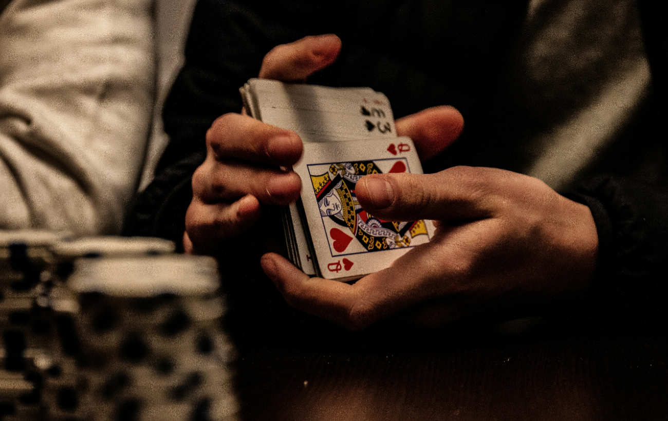 Man shuffling cards in the hands