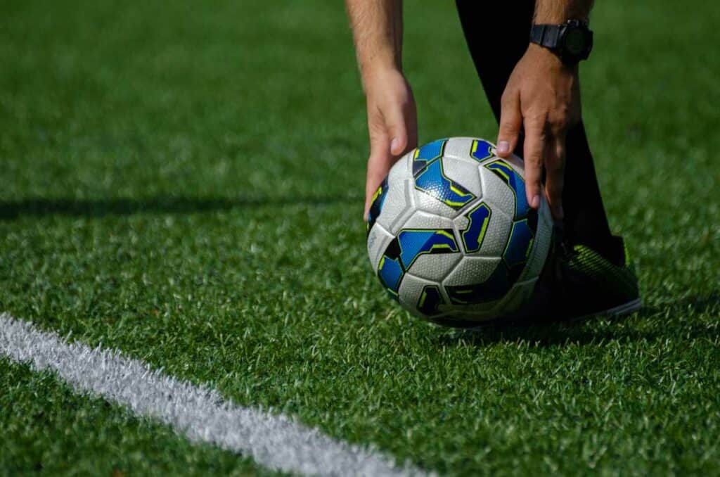 Man preparing to kick the football ball