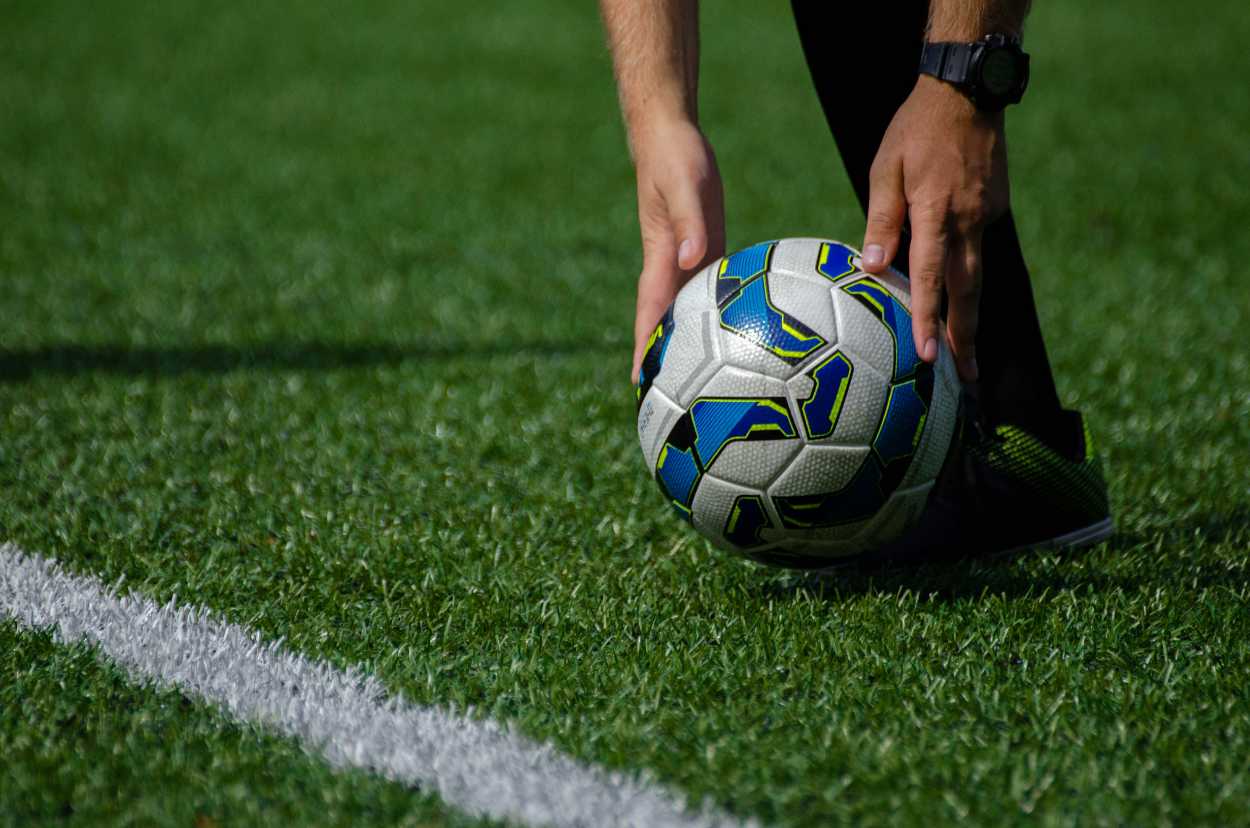 Man preparing to kick the football ball