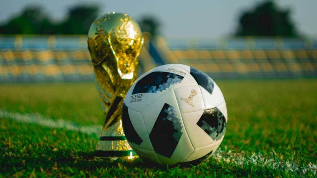 Football ball an a world cup trophy