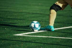 Man kicking a football ball
